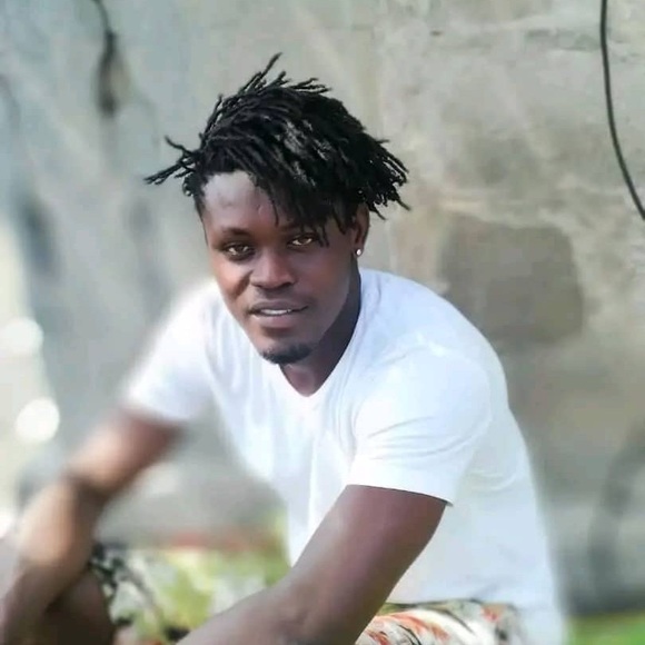 These shirts are made by Didier Adjewodo of Togo, West Africa. - Picture 6 of 6